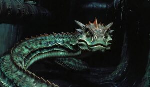 Bazyliszek w Harrym Potterze. Szmaragdowozielony gad znany z opisów bazyliszka z uniwersum Harry'ego Pottera